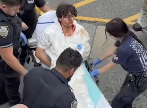 Staten Island teenager Damien Hurstel being loaded onto a stretcher covered in blood